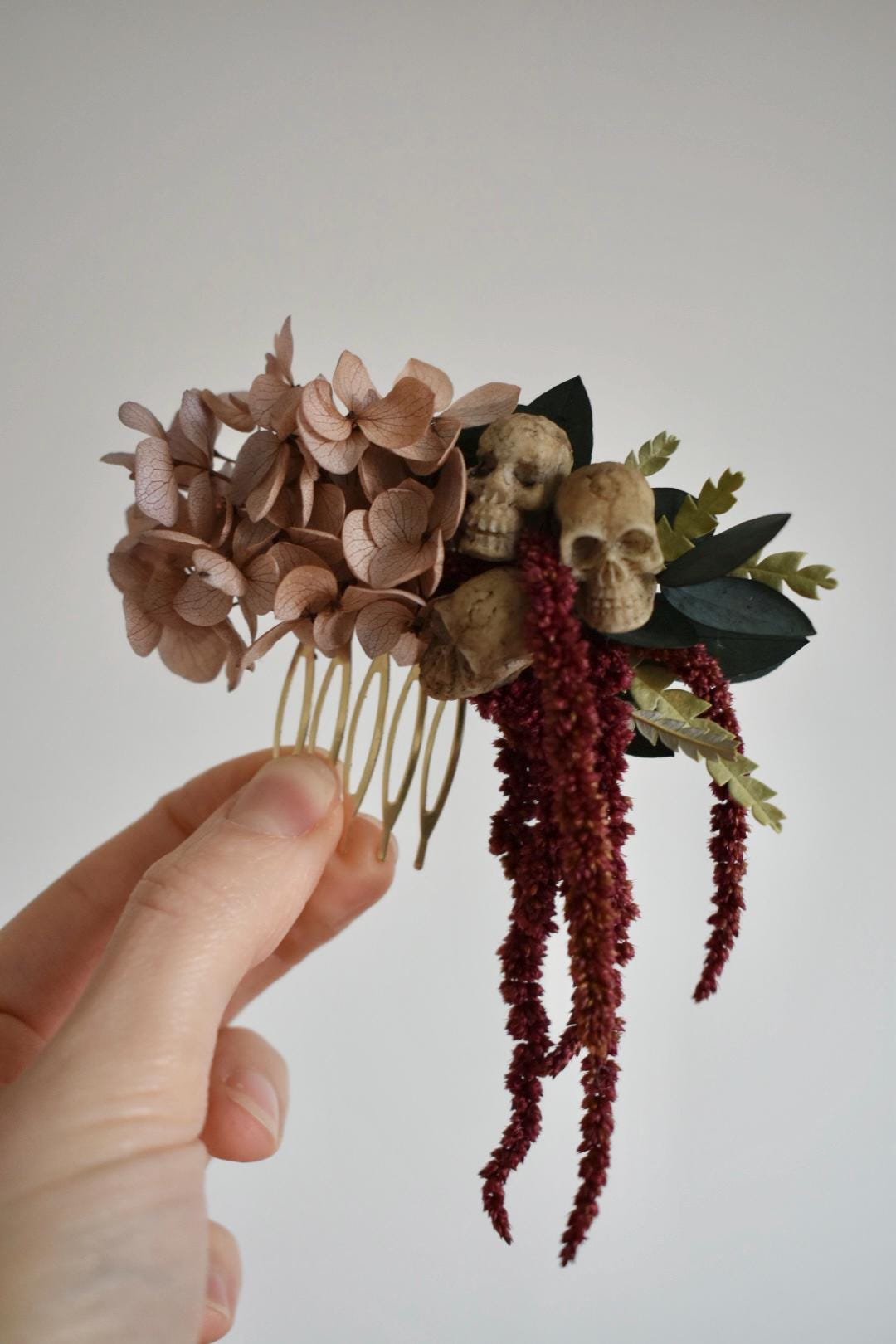 Floral comb with mini faux skulls