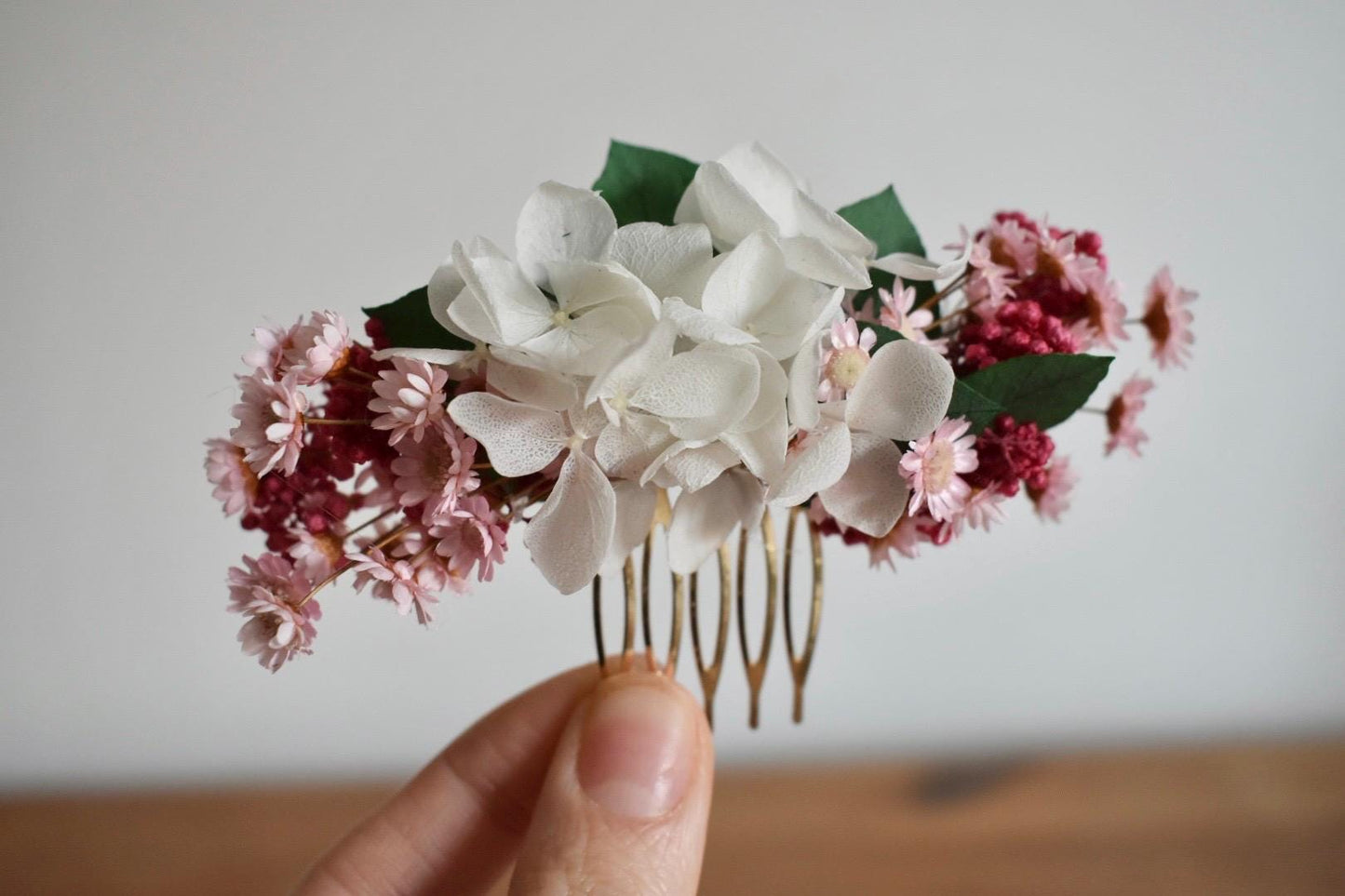 Pink and white floral hair comb