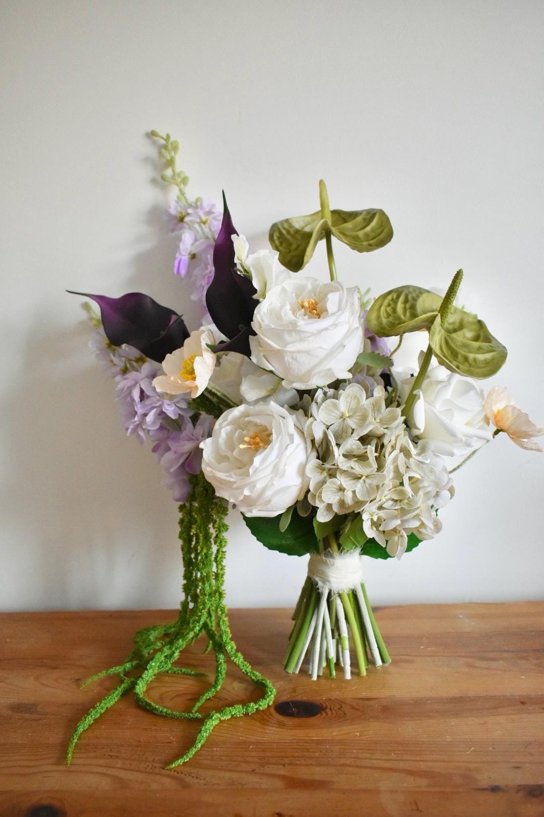 Trailing amaranthus wedding bouquet with anthuriums