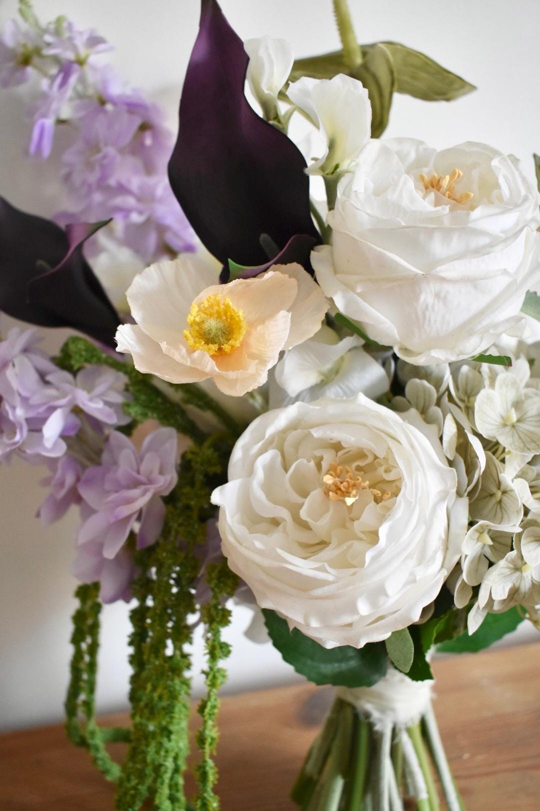 Trailing amaranthus wedding bouquet with anthuriums