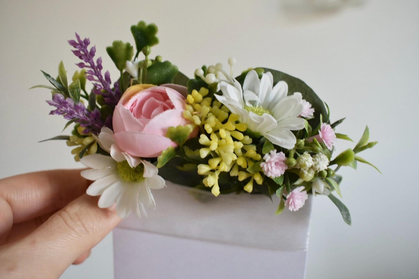 Daisy and ranunculus pocket boutonniere
