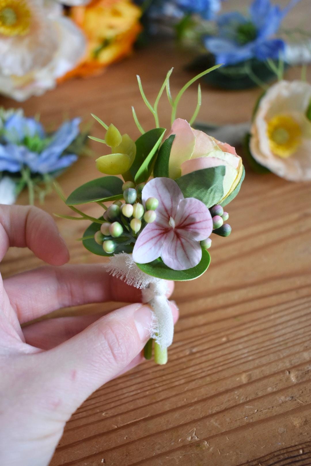 Ranunculus bud and pink hydrangea button hole
