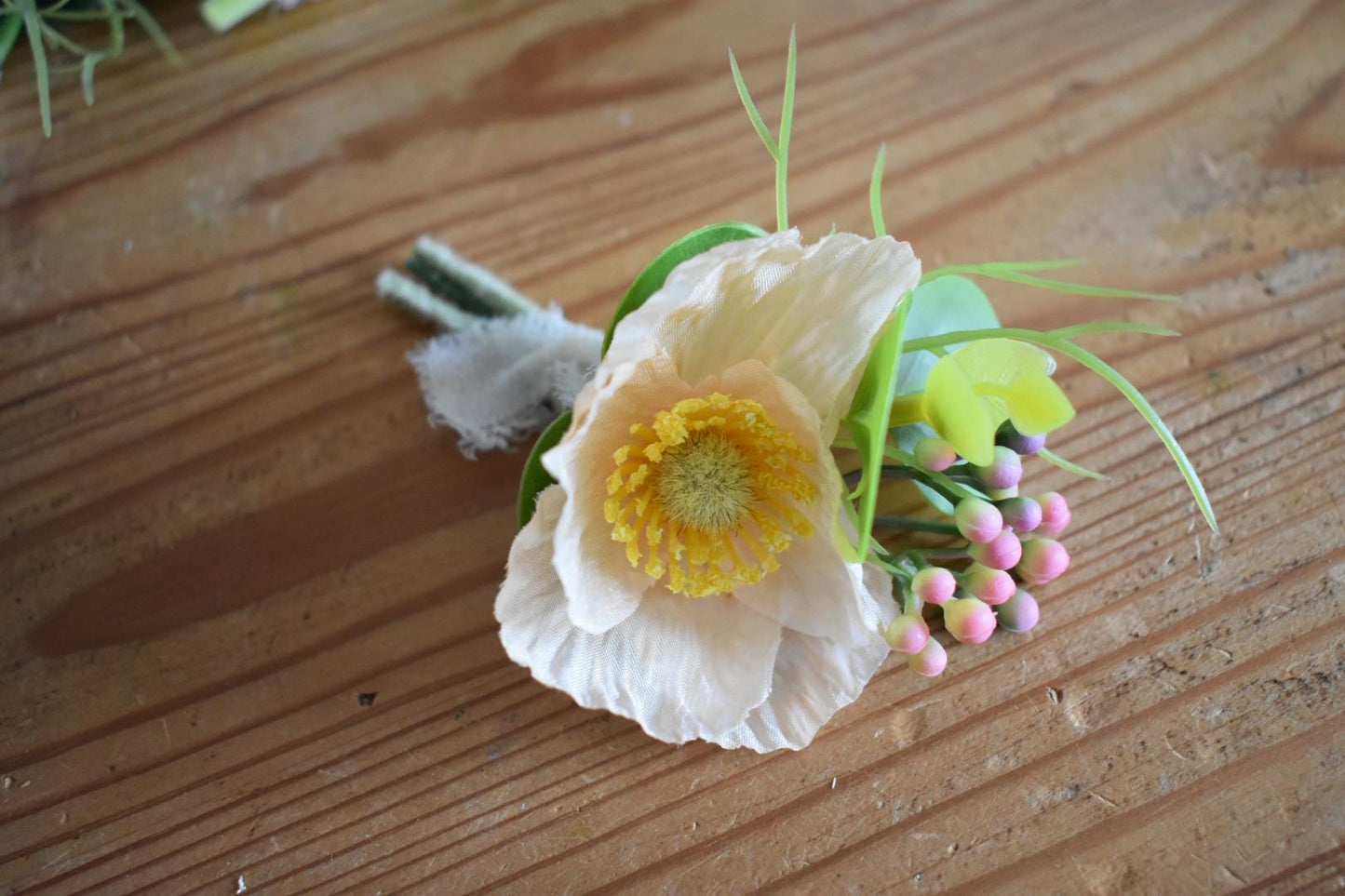 Peach poppy button hole