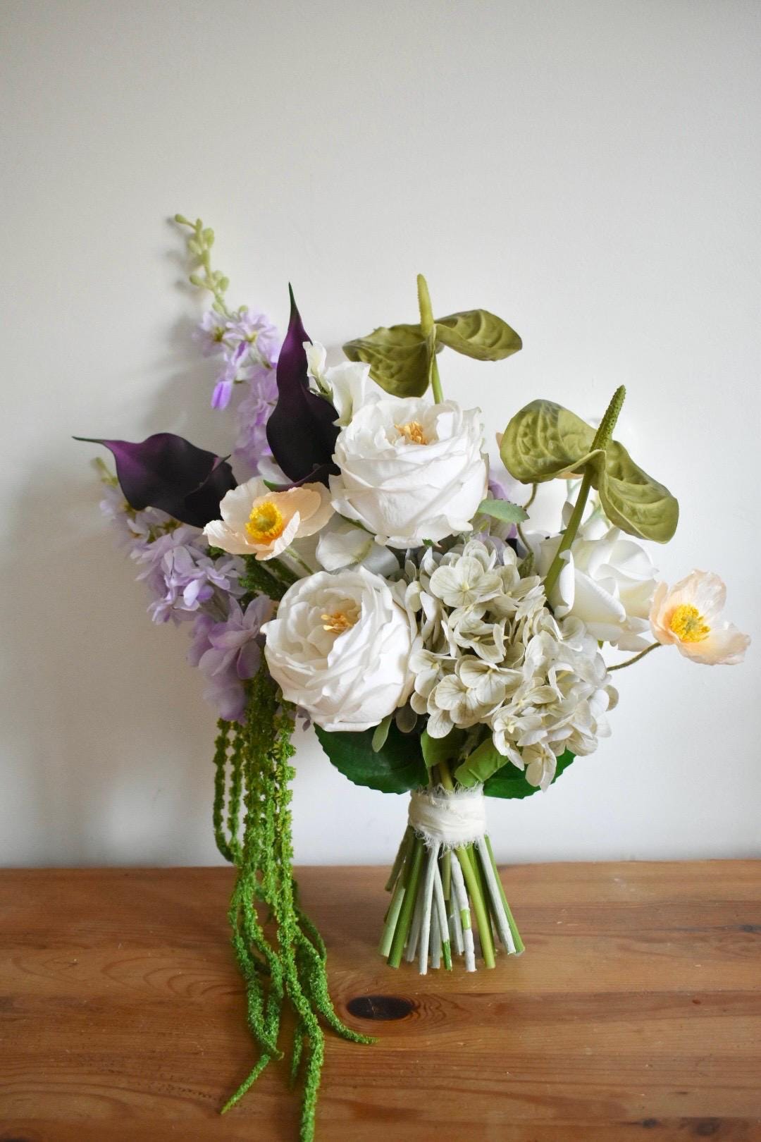 Trailing amaranthus wedding bouquet with anthuriums