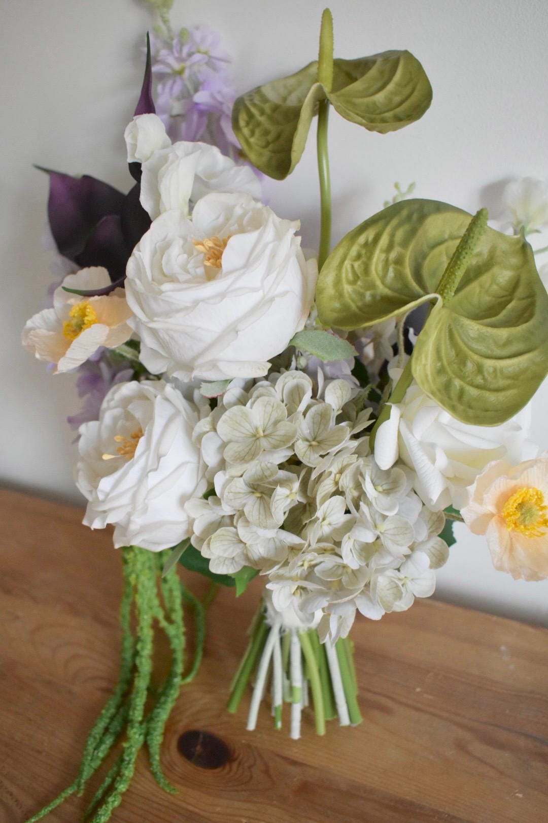 Trailing amaranthus wedding bouquet with anthuriums