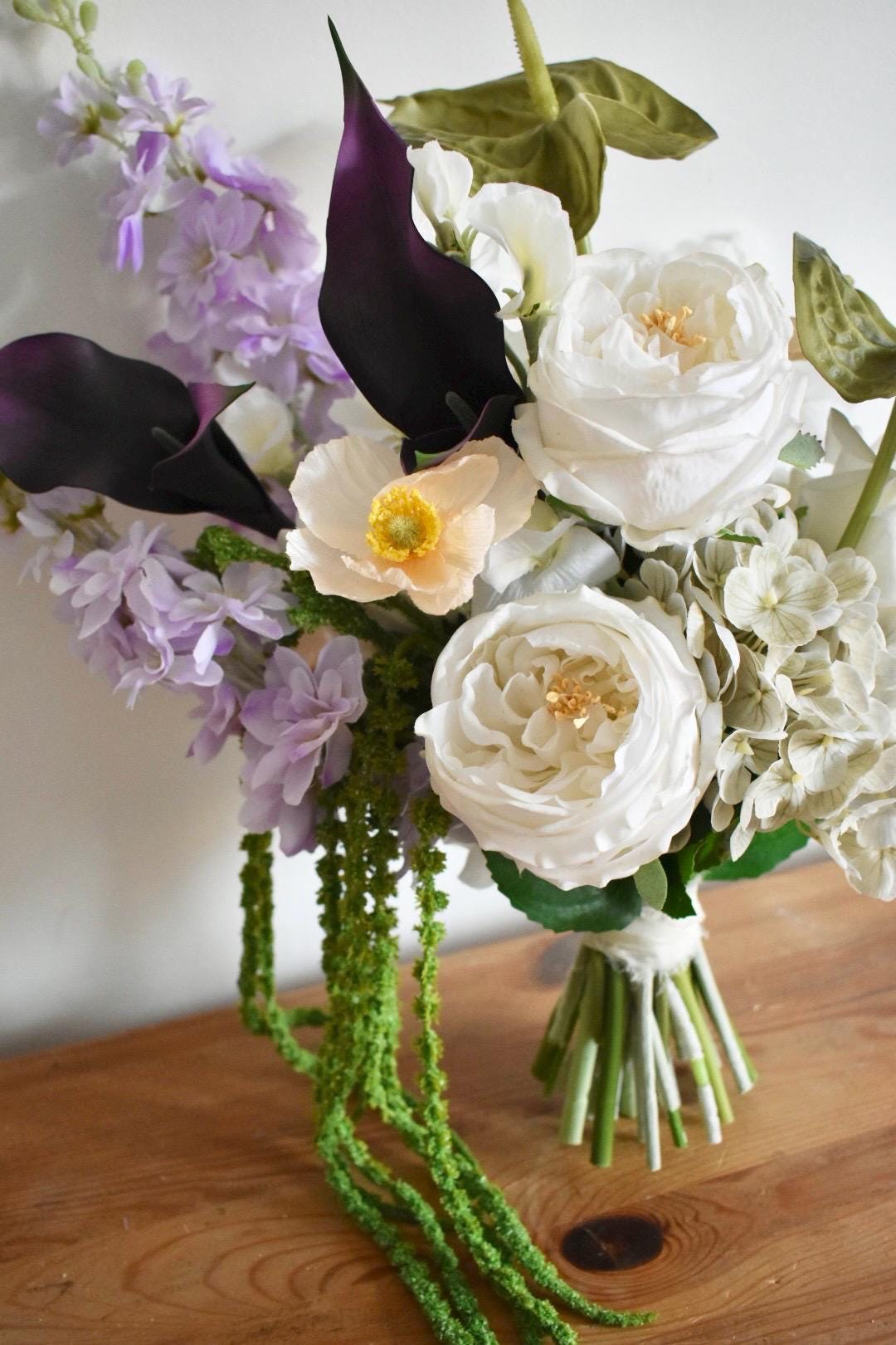 Trailing amaranthus wedding bouquet with anthuriums