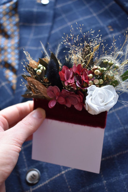 White rose and burgundy hydrangea pocket boutonniere