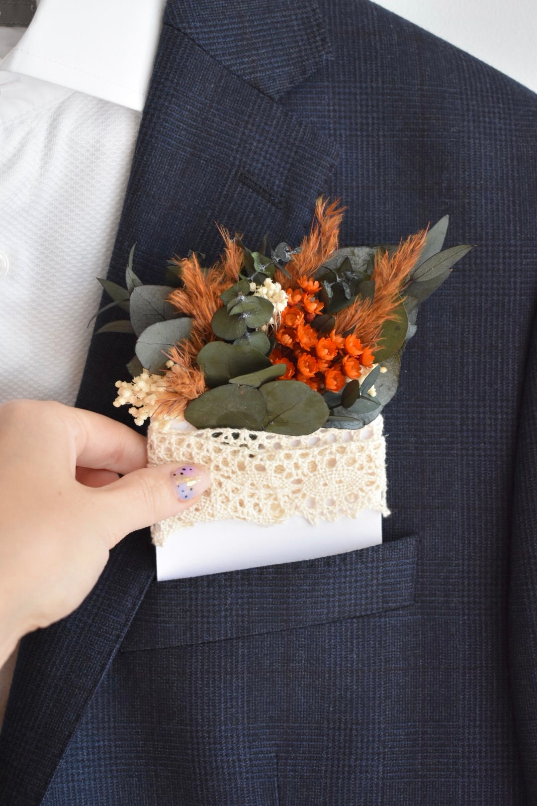 Orange pampas pocket boutonniere