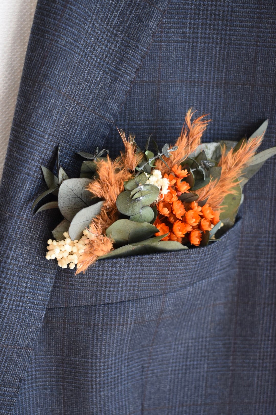 Orange pampas pocket boutonniere