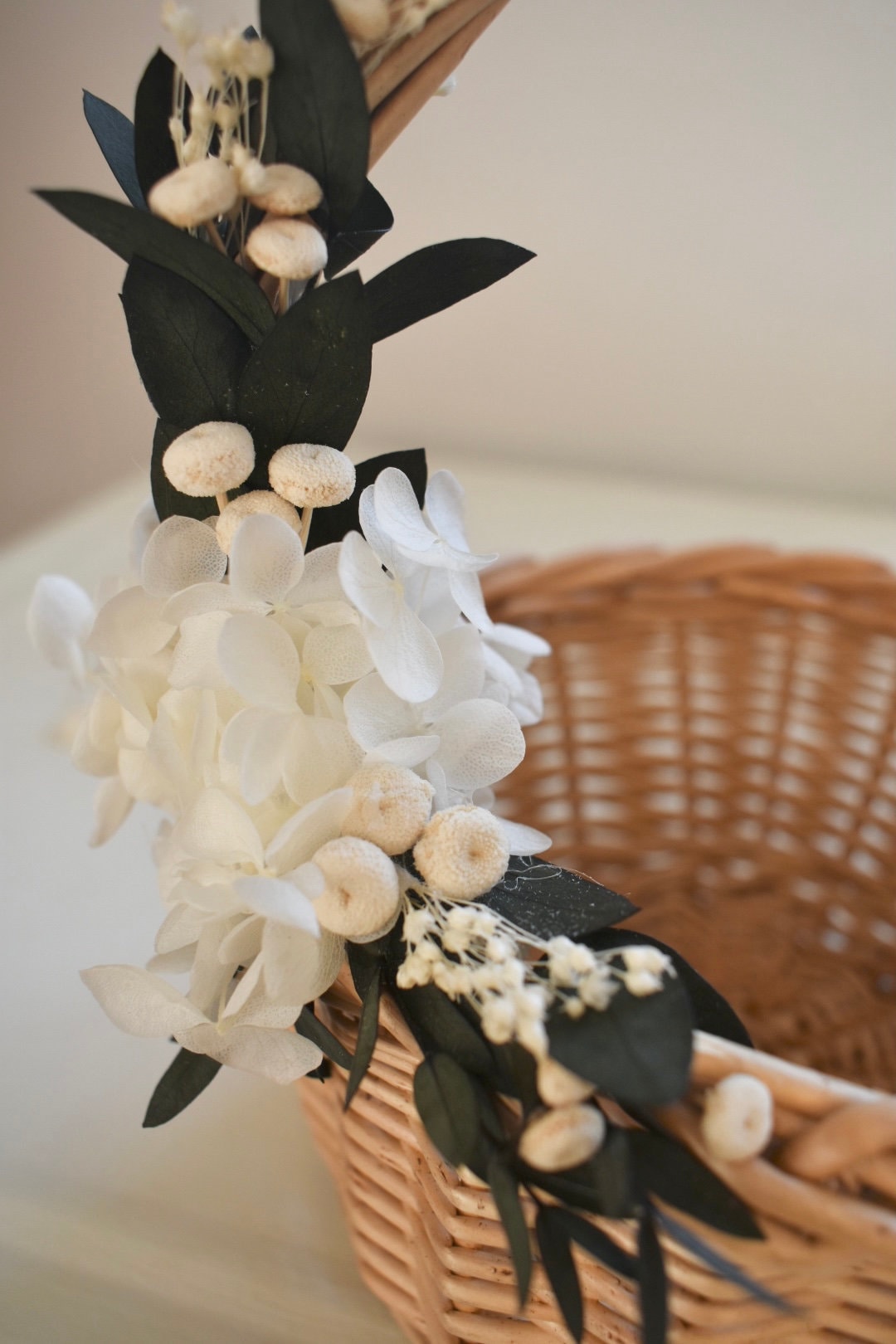 Bleached hydrangea and eucalyptus flower girl basket