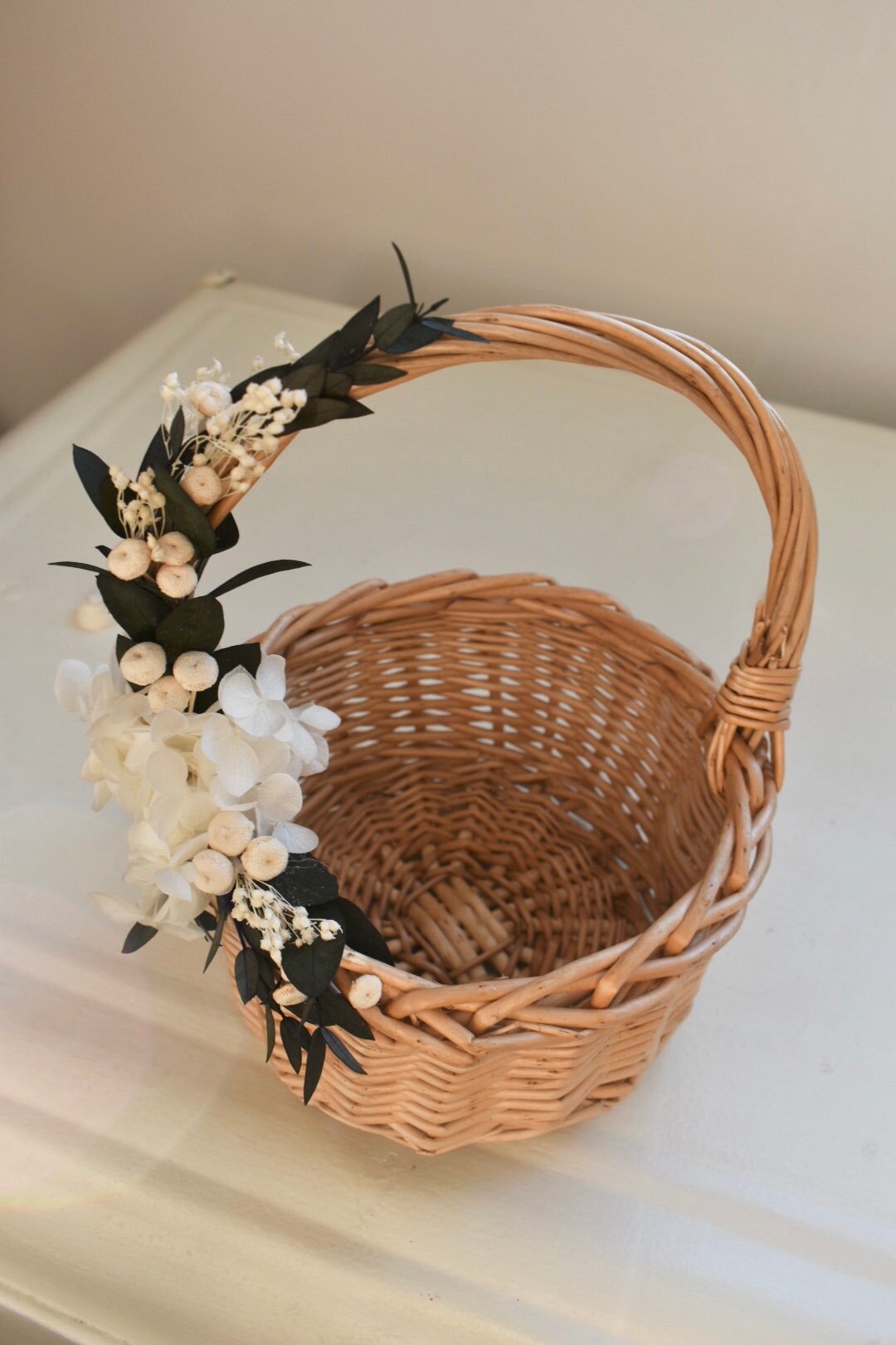 Bleached hydrangea and eucalyptus flower girl basket