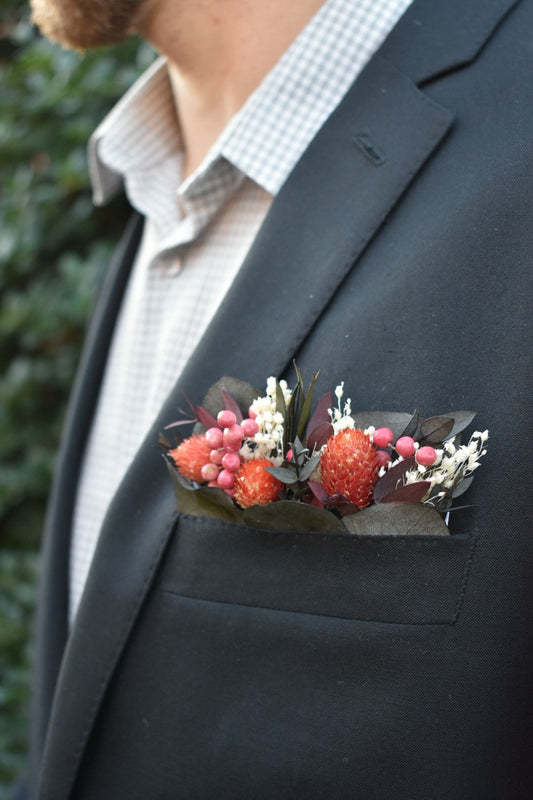 Pink berry pocket boutonniere