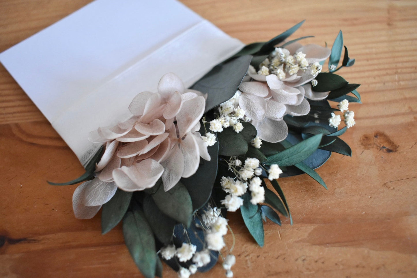 Eucalyptus, nude hydrangea and gypsophila pocket boutonniere