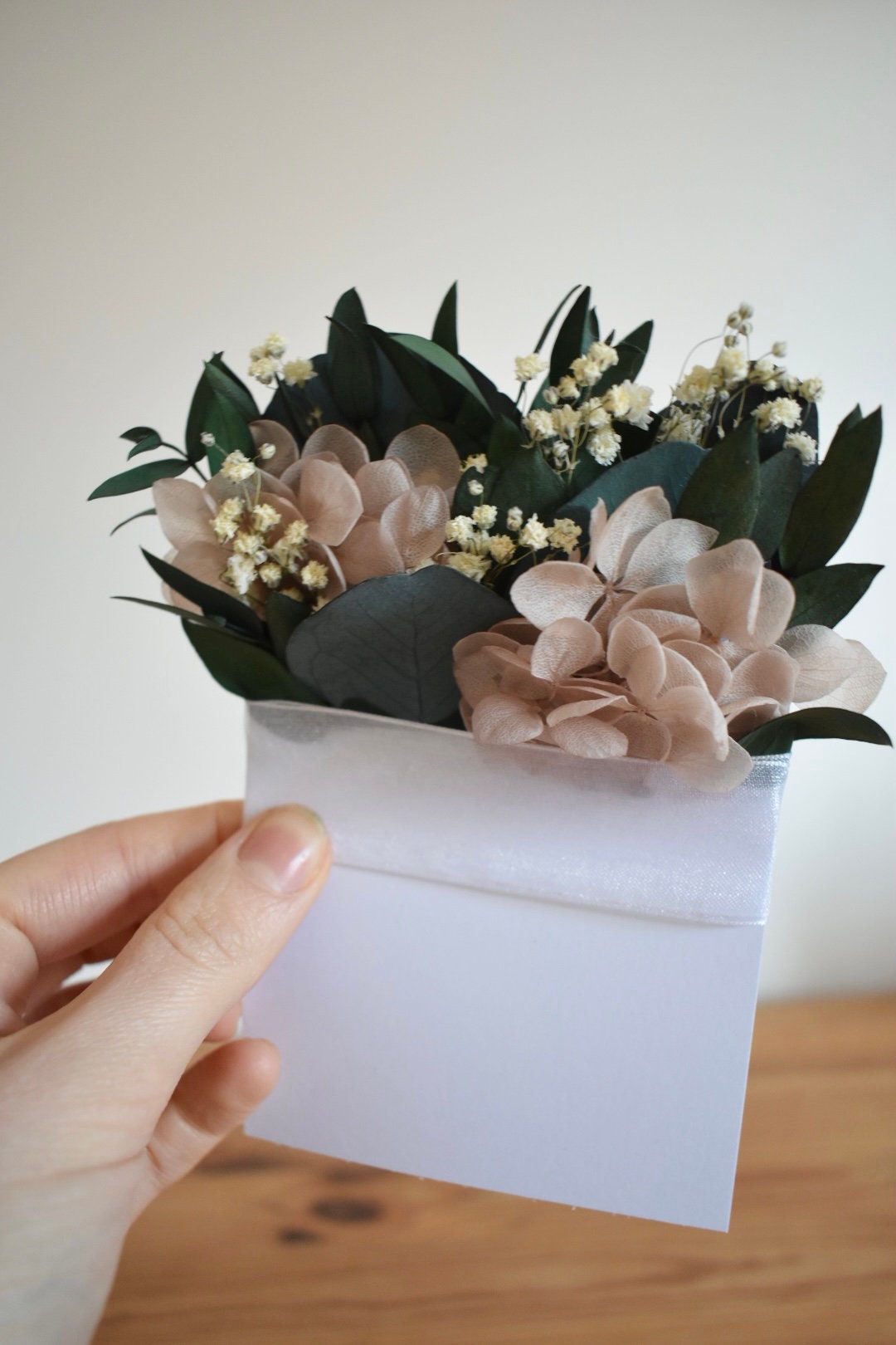 Eucalyptus, nude hydrangea and gypsophila pocket boutonniere
