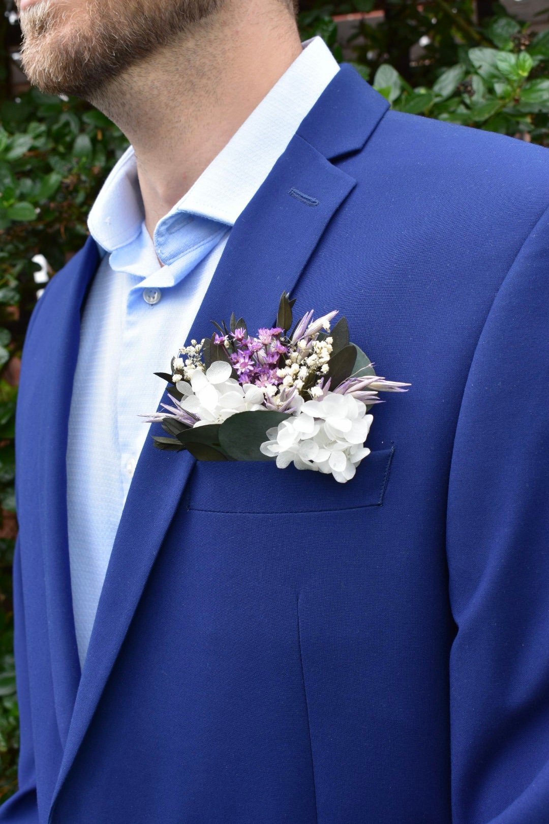 Purple and white pocket boutonniere with gypsophila and hydrangea