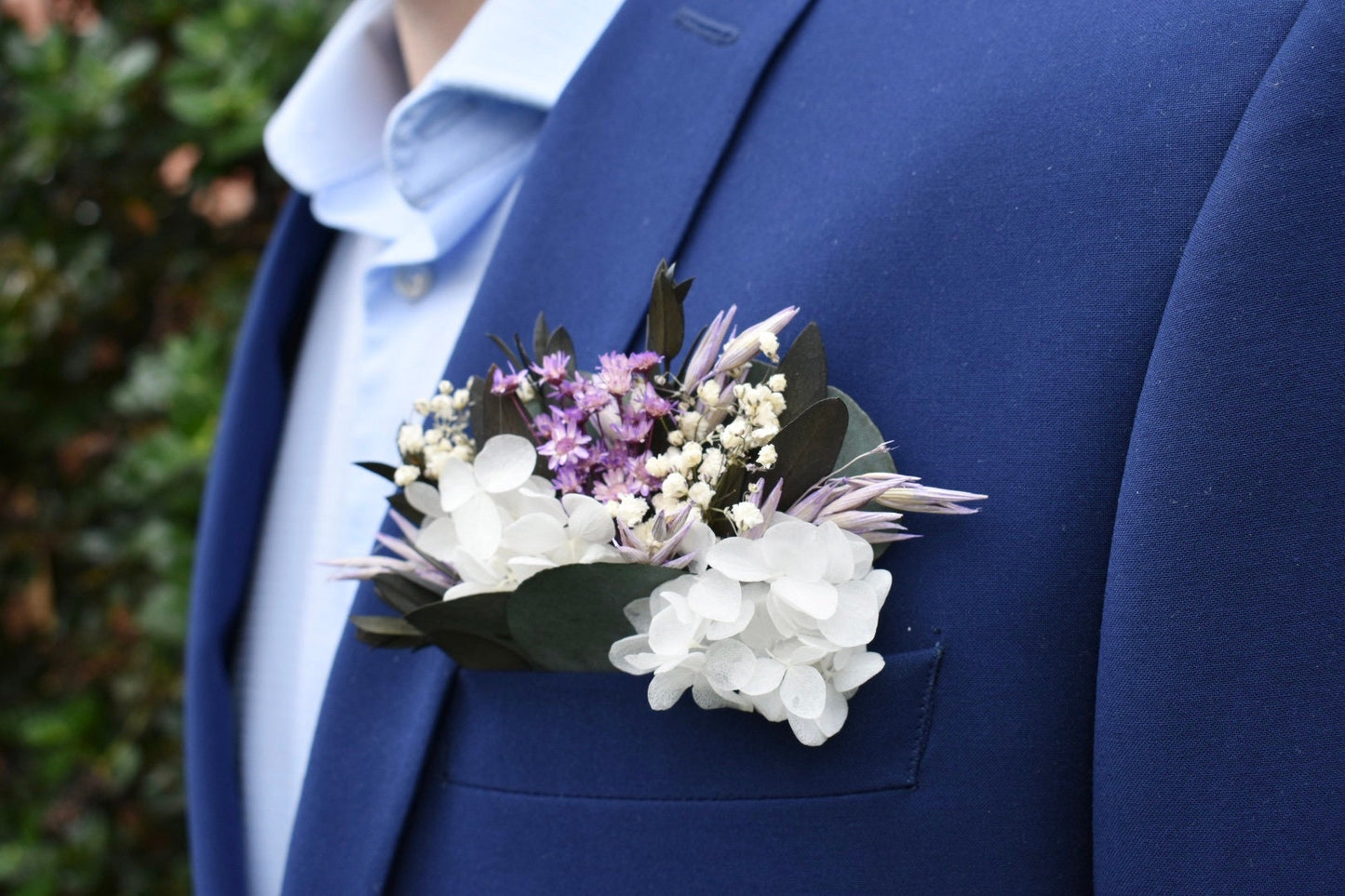Purple and white pocket boutonniere with gypsophila and hydrangea