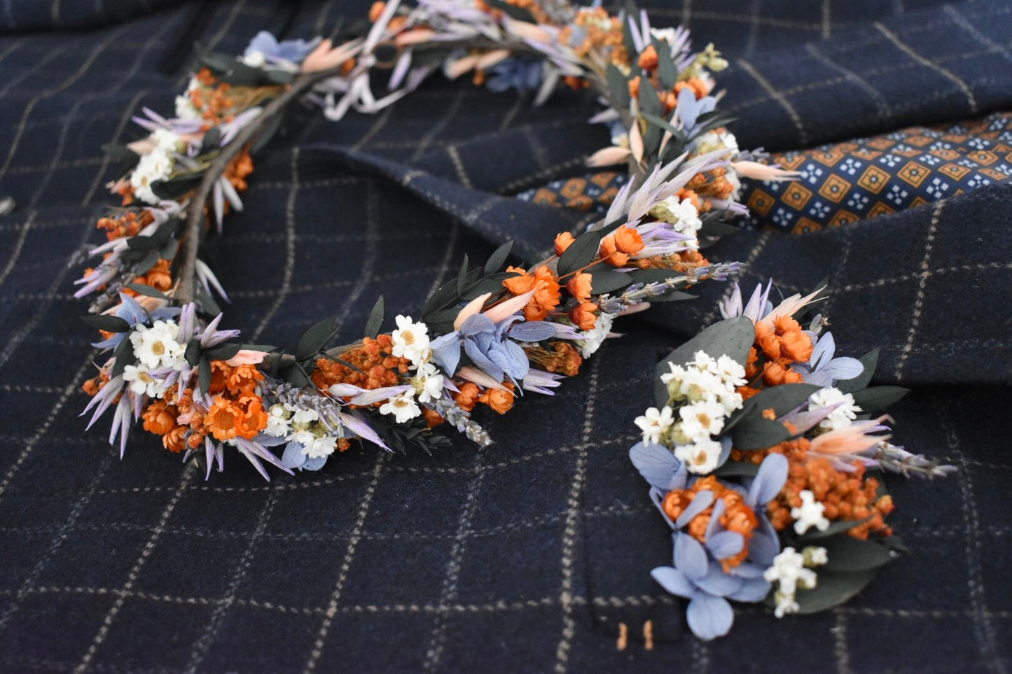 Orange, blue and lilac pocket boutonniere