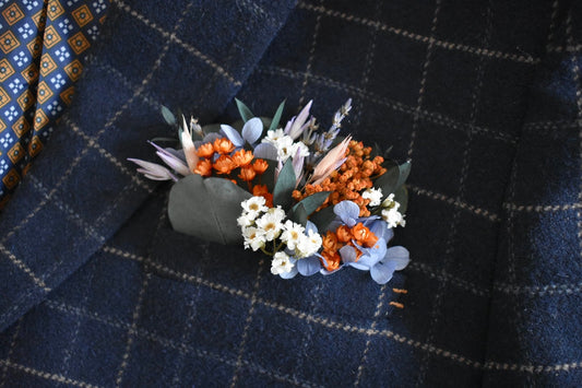 Orange, blue and lilac pocket boutonniere