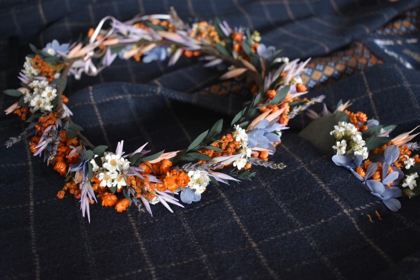 Orange, blue and lilac pocket boutonniere