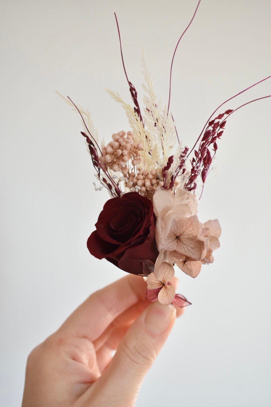 Nude, blush and red boutonniere