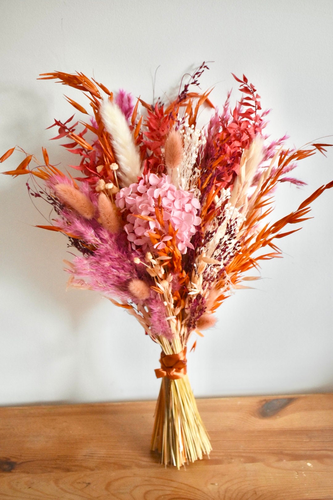 Pink and orange bright dried flower bouquet