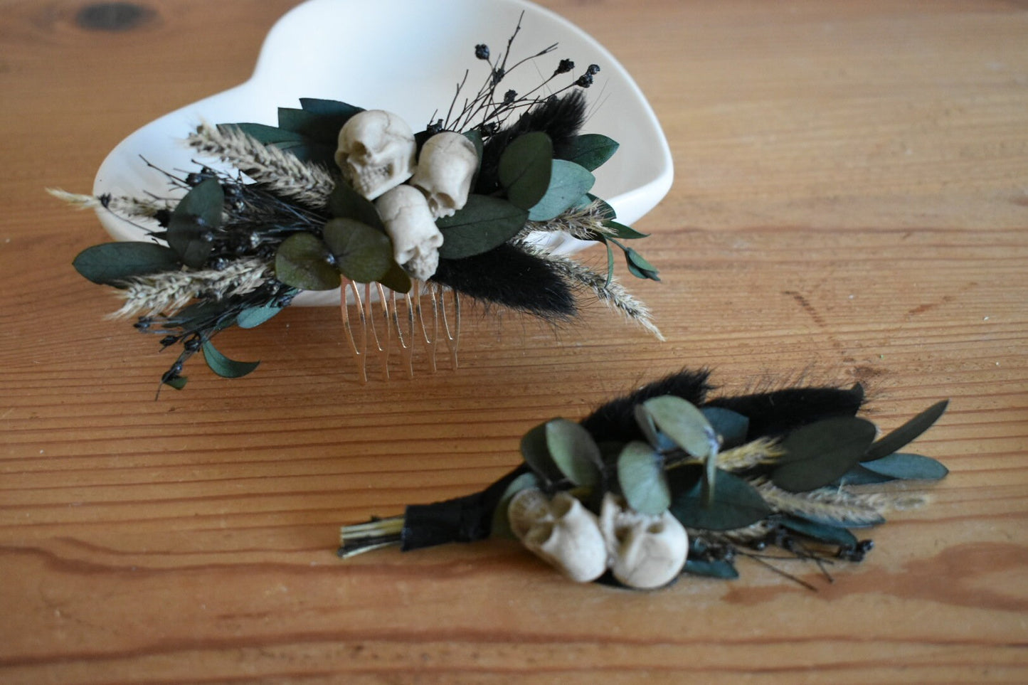 Black dried foliage boutonniere with mini faux skulls