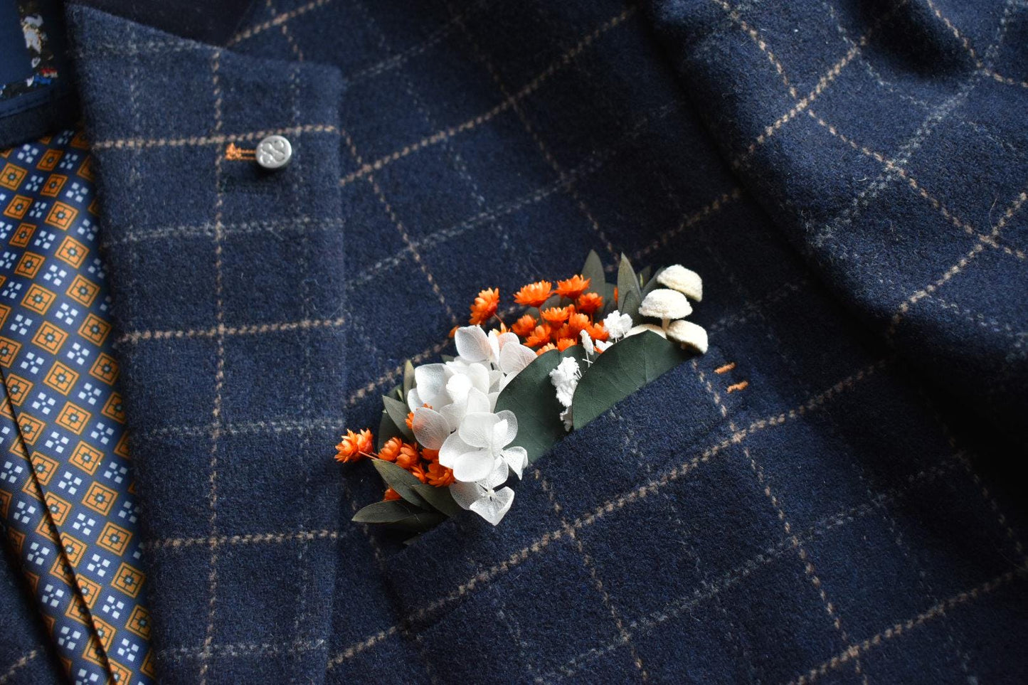 Orange pocket boutonniere