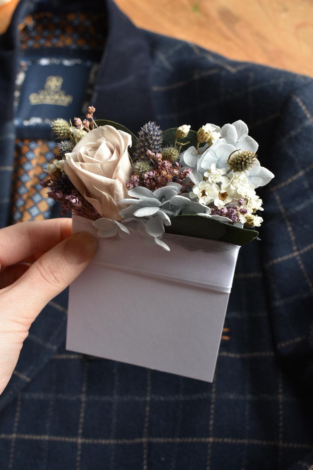 Pale blue and purple pocket boutonniere