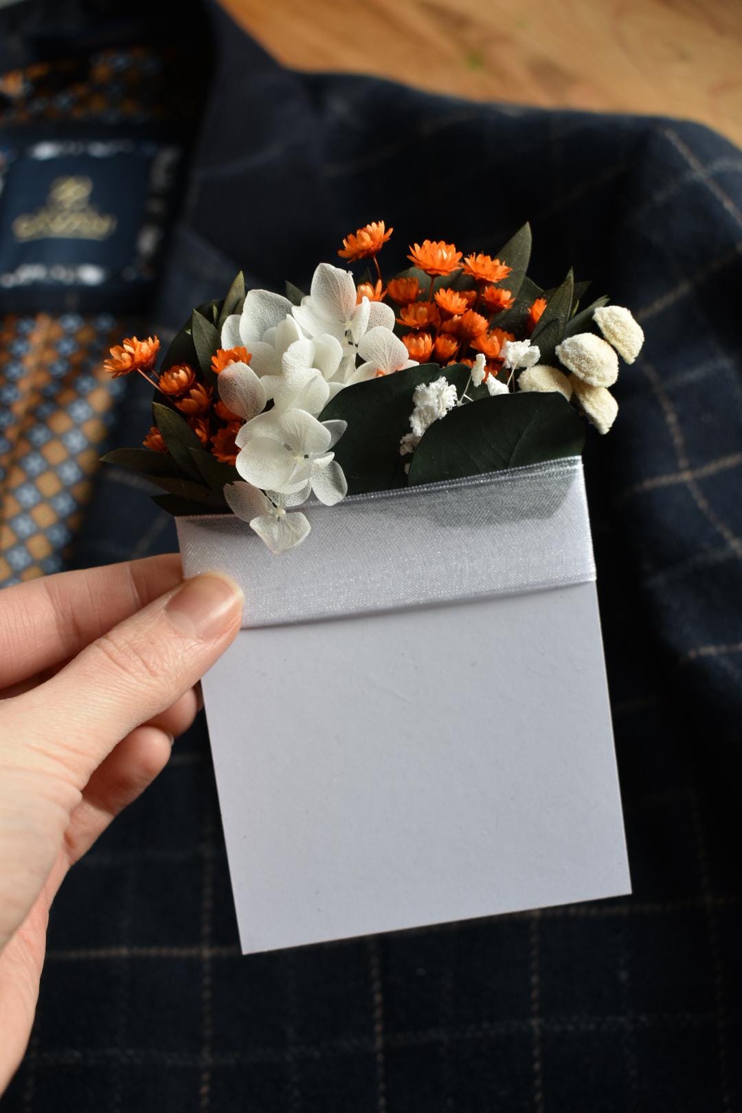 Orange pocket boutonniere