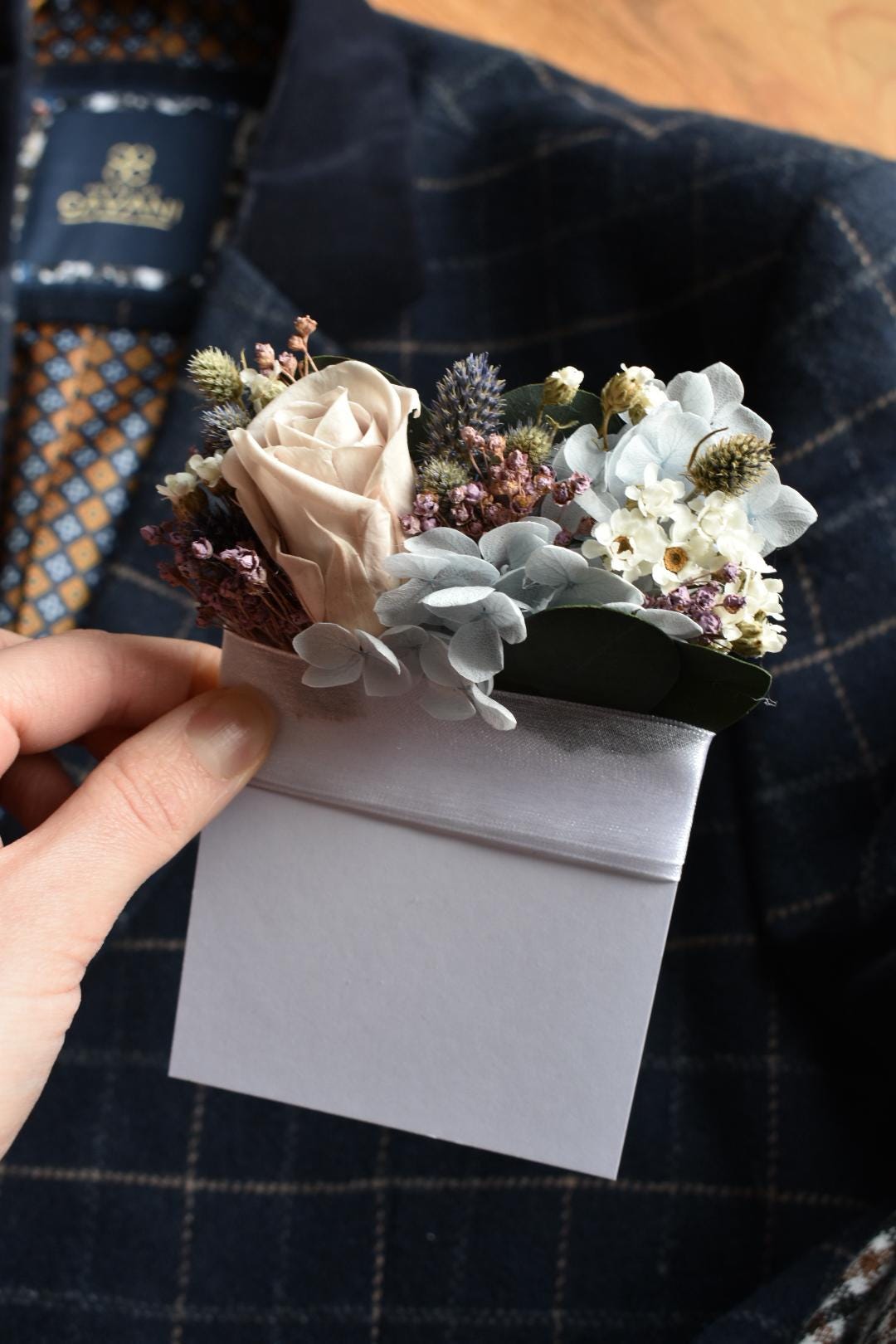 Pale blue and purple pocket boutonniere