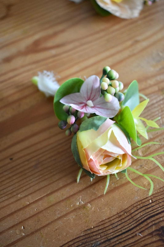 Ranunculus bud and pink hydrangea button hole