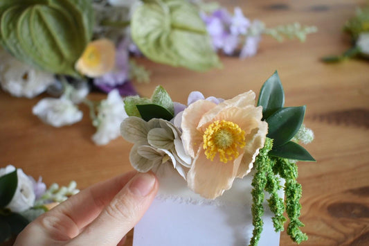 Peach poppy pocket boutonniere with trailing amaranthus