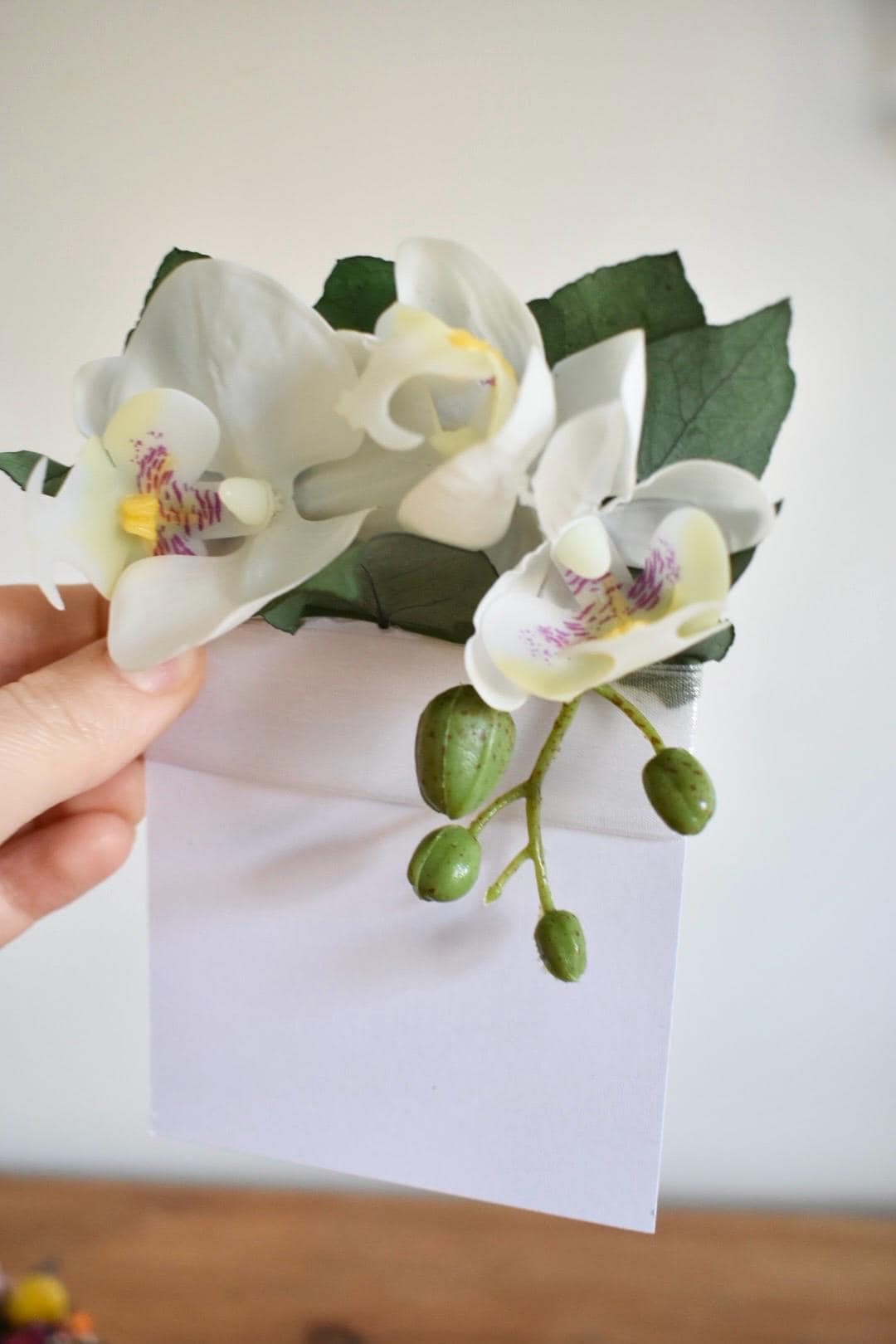 White orchid pocket boutonniere