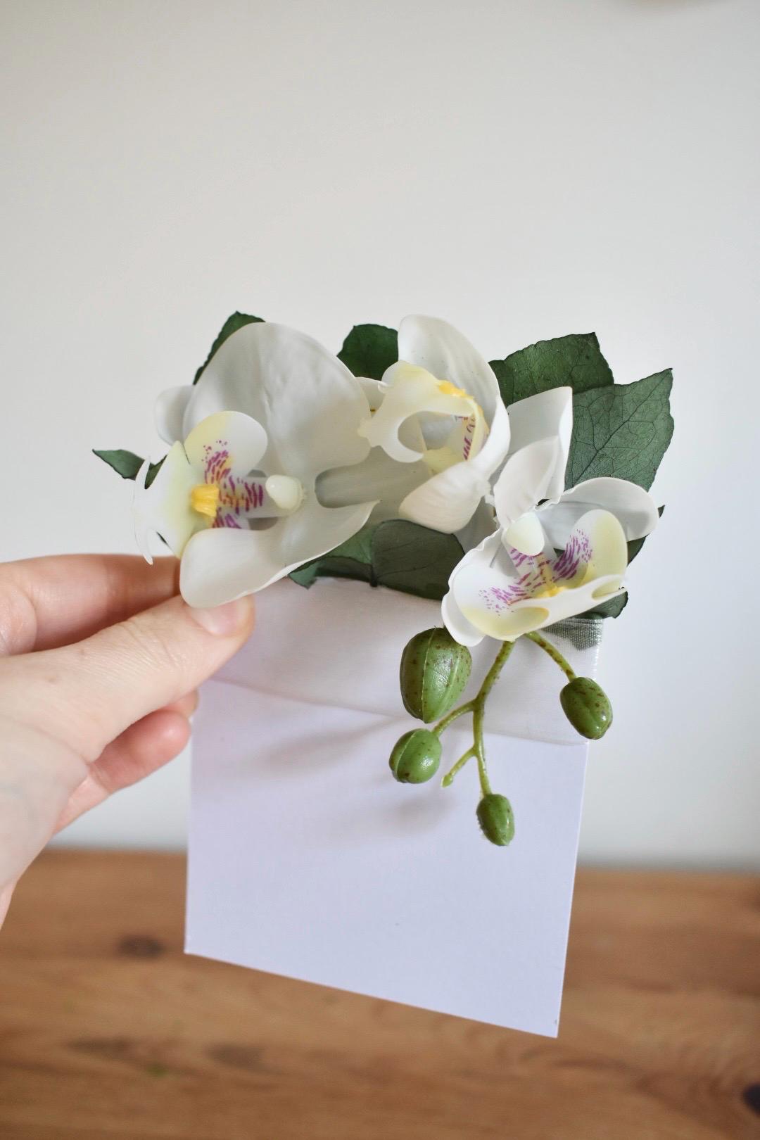 White orchid pocket boutonniere