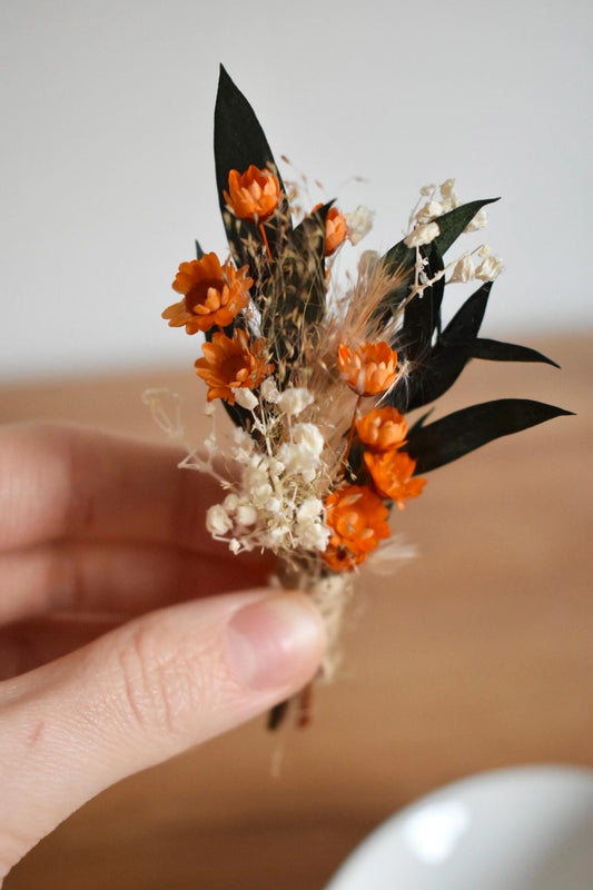 Orange dried flower boutonniere