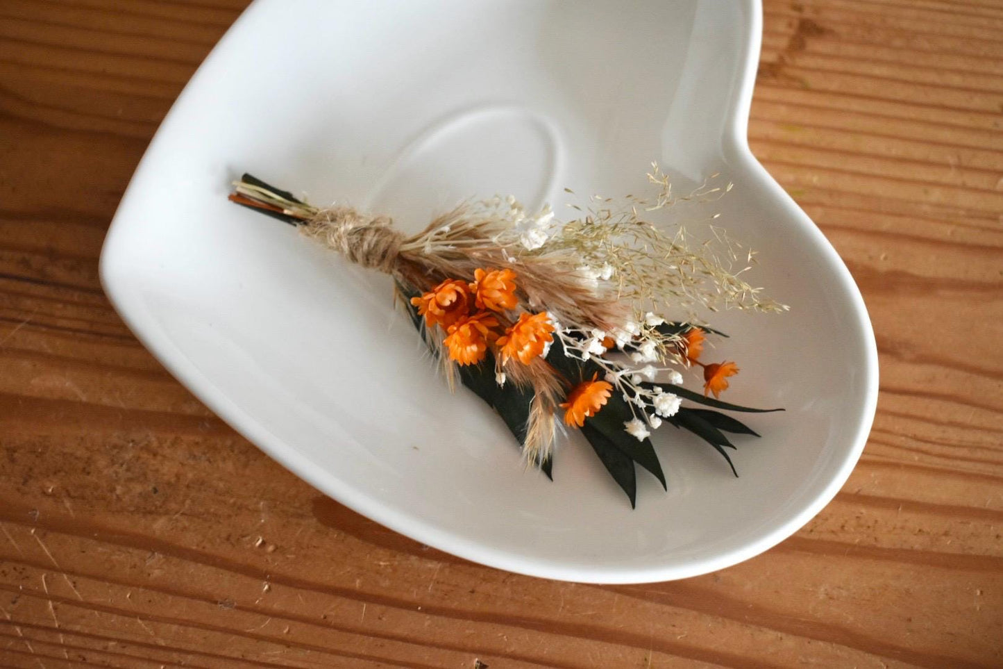 Orange dried flower boutonniere