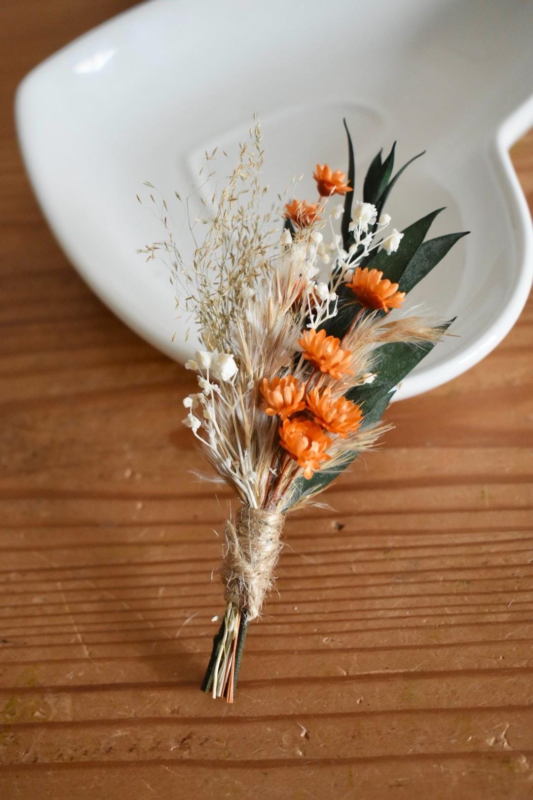 Orange dried flower boutonniere
