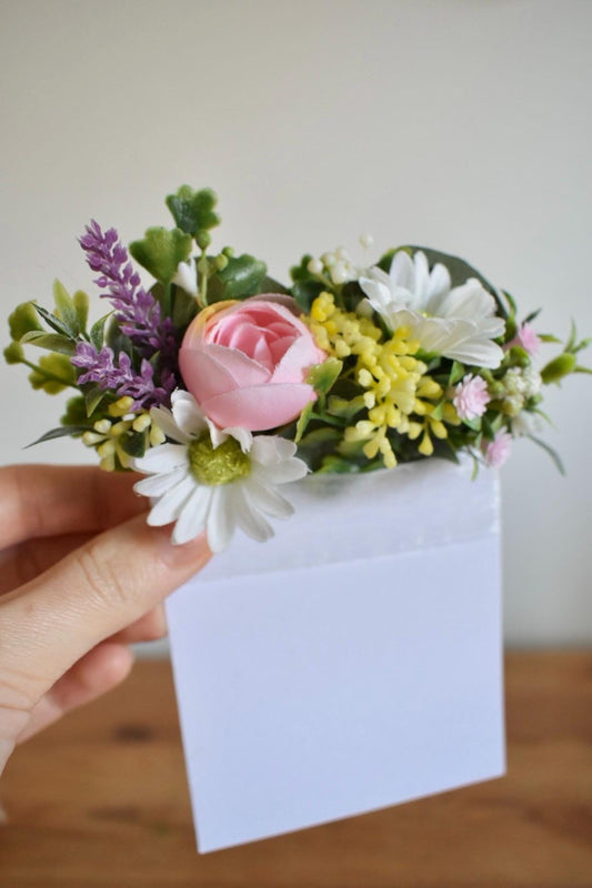 Daisy and ranunculus pocket boutonniere