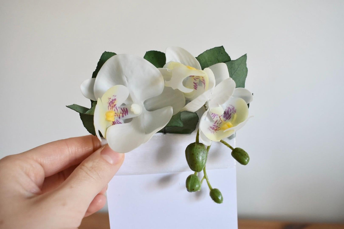 White orchid pocket boutonniere