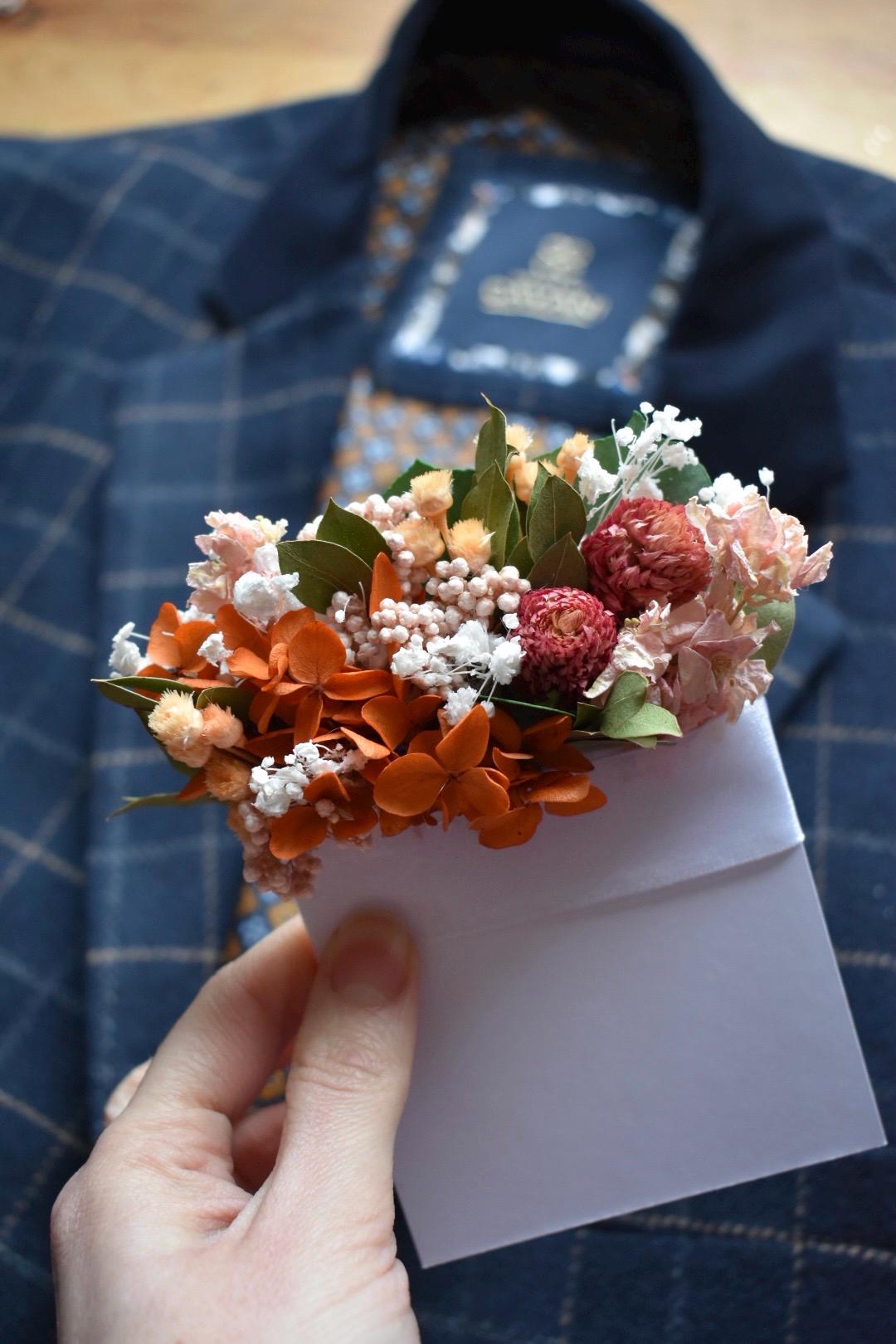 Orange and pink pocket boutonniere