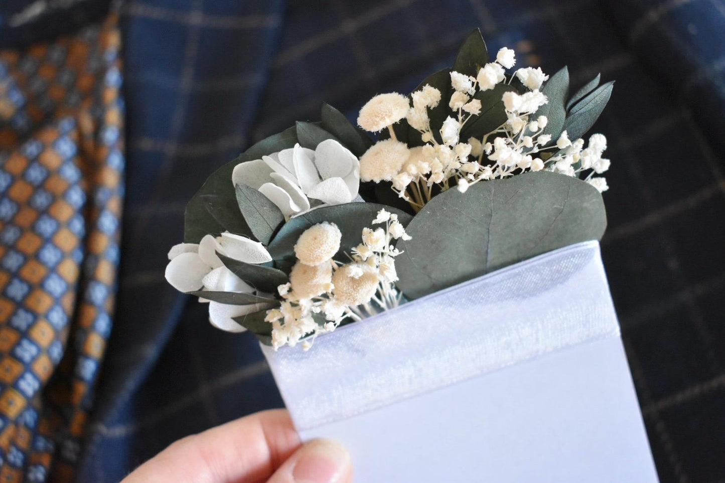 White hydrangea and eucalyptus pocket boutonniere