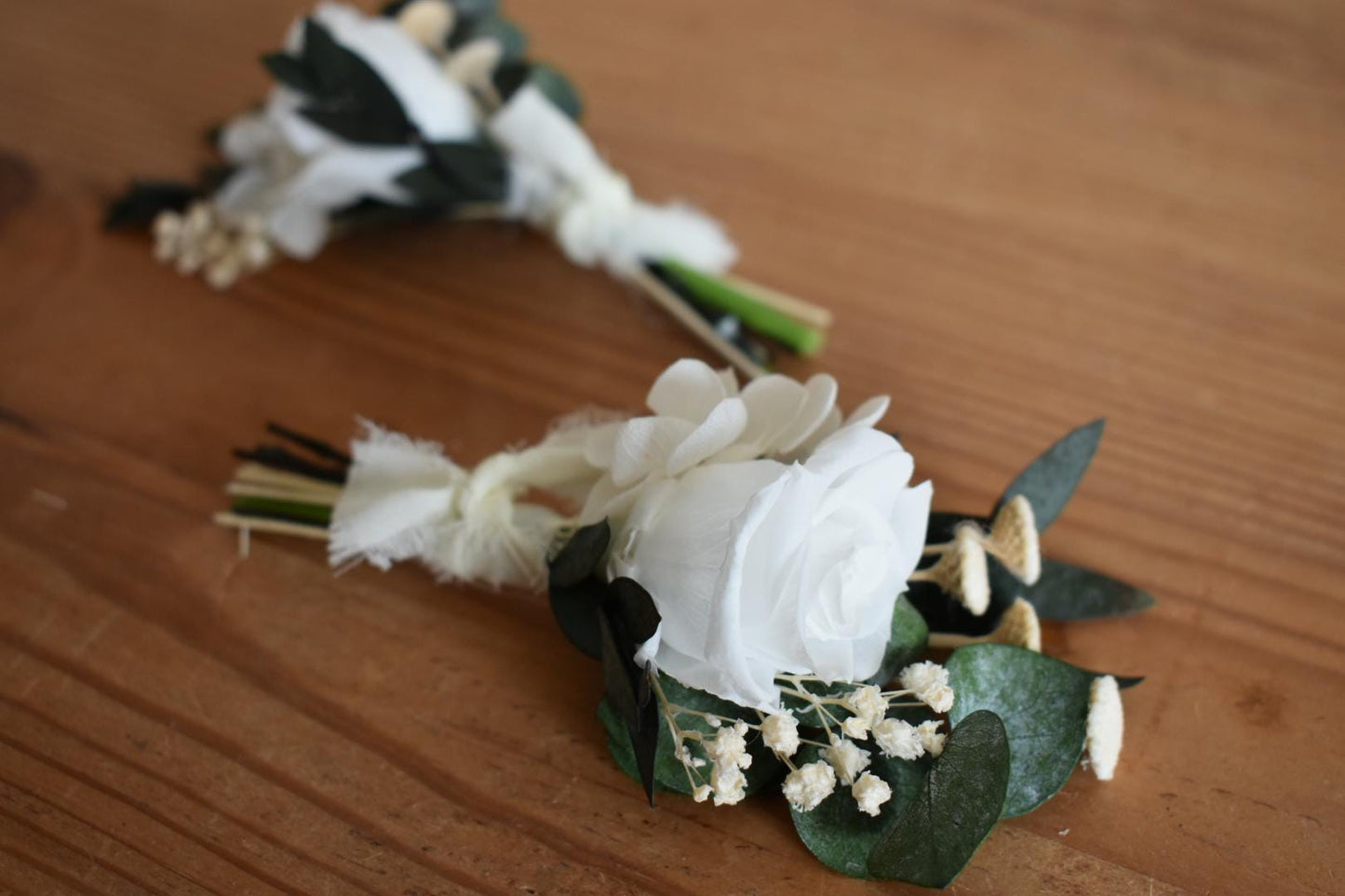 White rose and foliage boutonniere