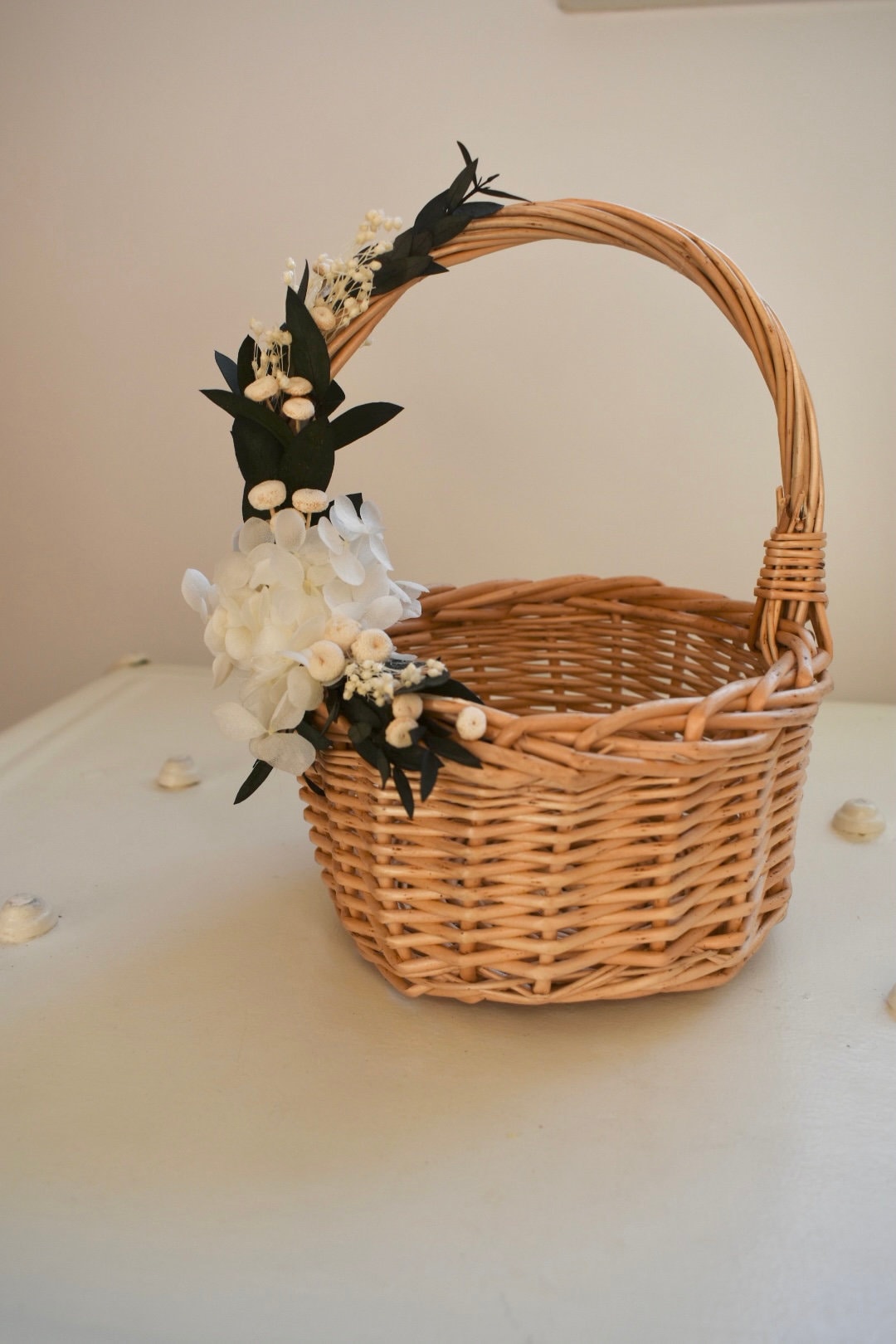 Bleached hydrangea and eucalyptus flower girl basket