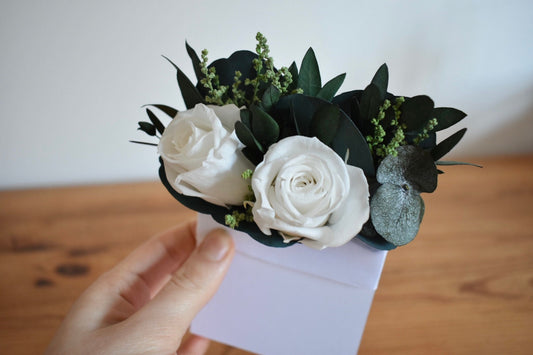 Pocket boutonniere with white roses