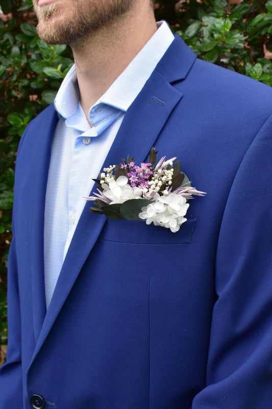 Purple and white pocket boutonniere with gypsophila and hydrangea