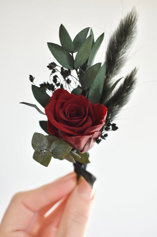 Red and black boutonniere