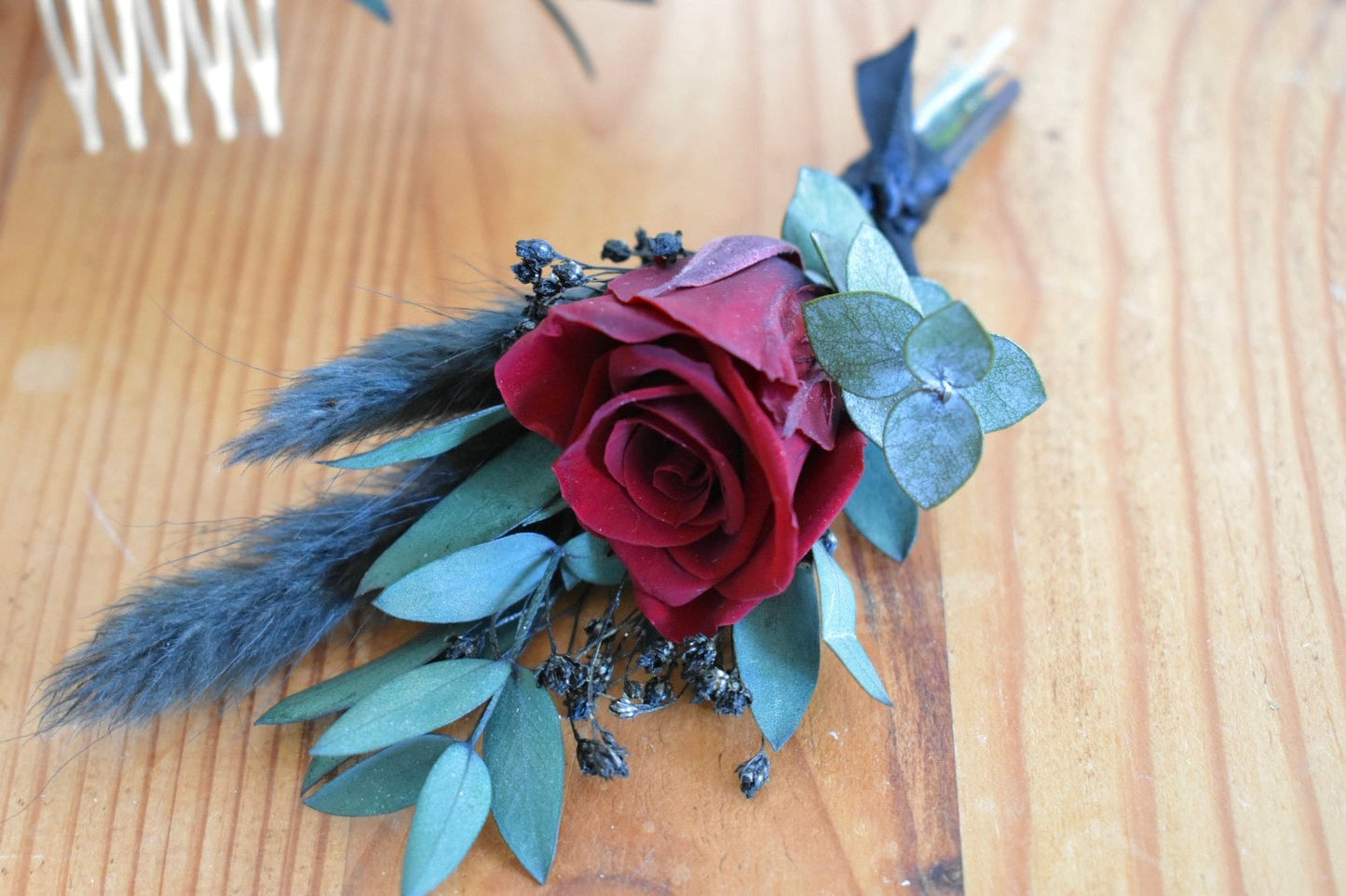 Red and black boutonniere