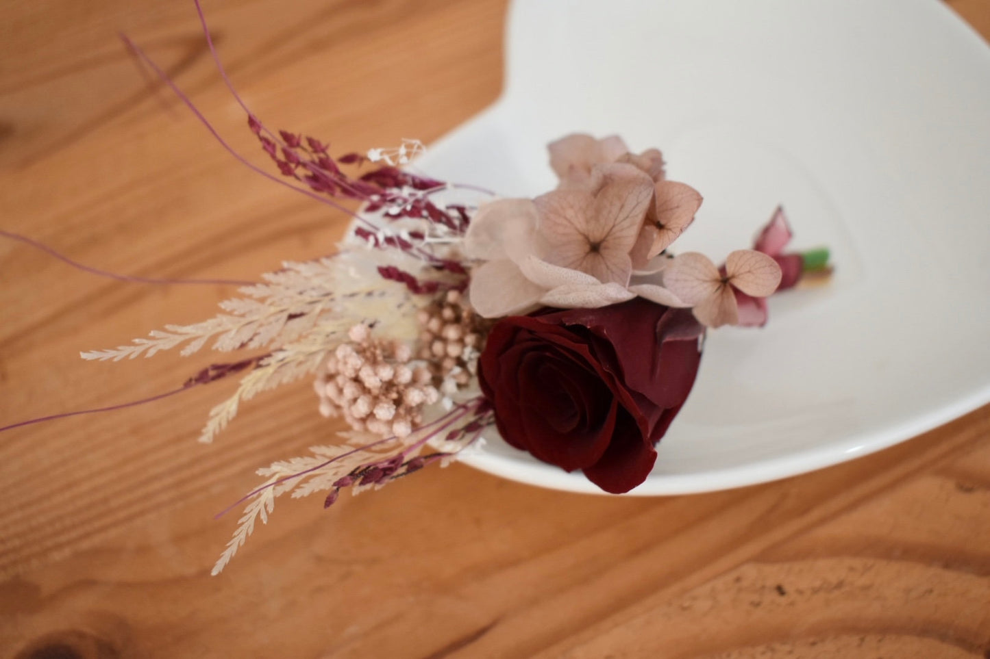 Nude, blush and red boutonniere