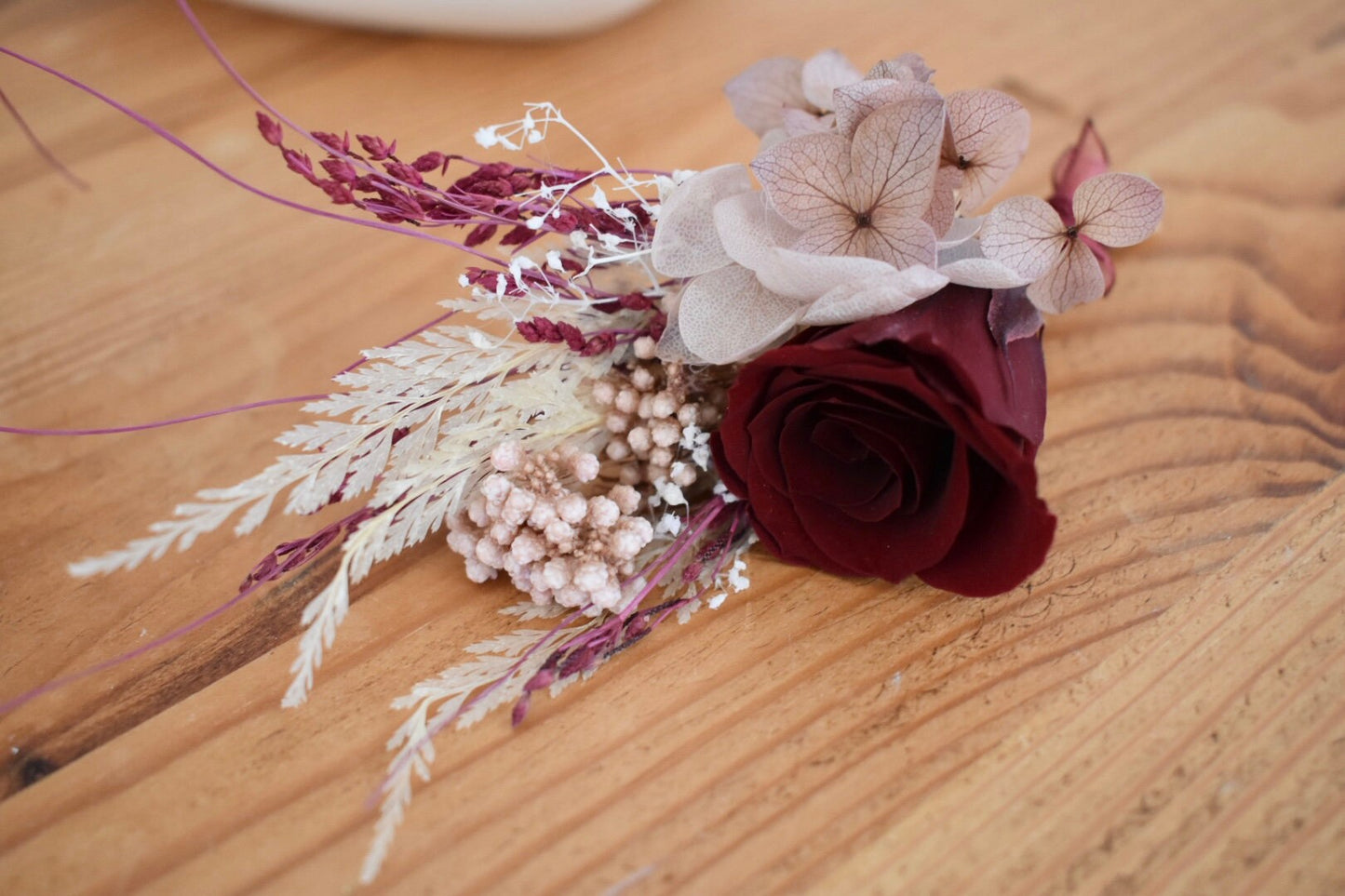 Nude, blush and red boutonniere