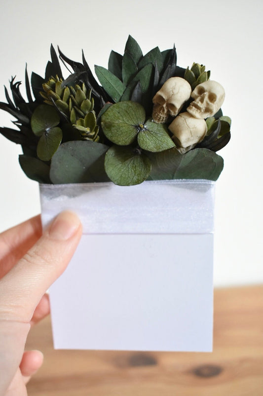 Pocket boutonniere with skulls and preserved greenery